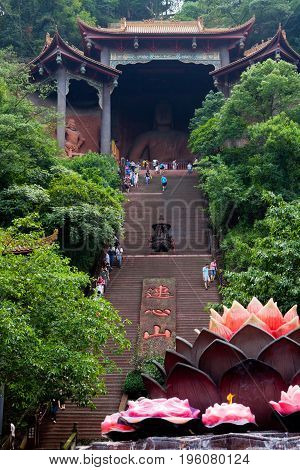 August 2014: lingyun shan mountain temple china visitors and devotees go to the temple. confucianism taoism and buddhism are the three main religions