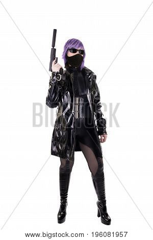 Sexy killer holding gun isolated on white background.