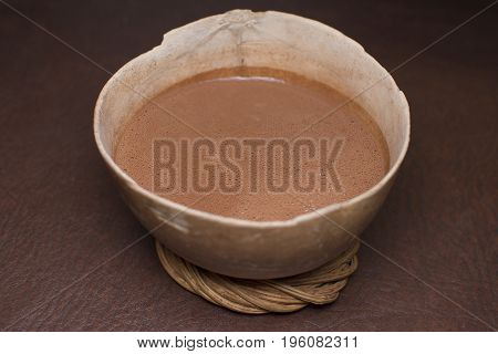 Chocolate beverage served in a traditional jicara bowl in southern Mexico