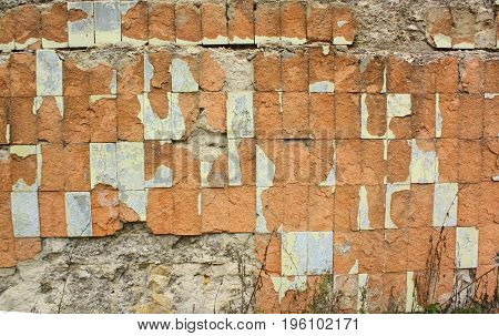 Old wall tiles. Grunge background. Aged tiling surface for design. Texture of old red brick wall.