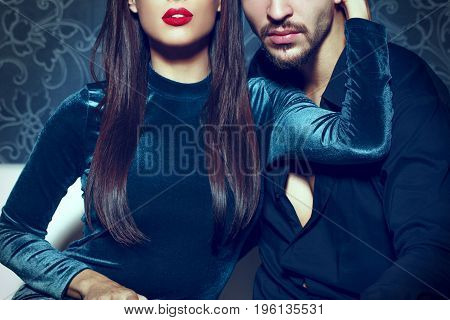 Sexy woman with red lips embrace young rich man seduction