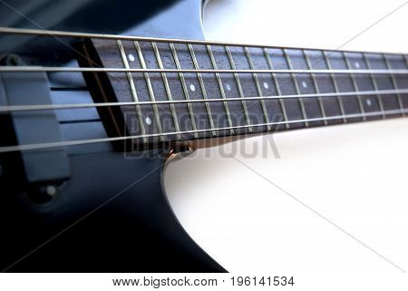 Black bass guitar with neck on a white background. Rock Club