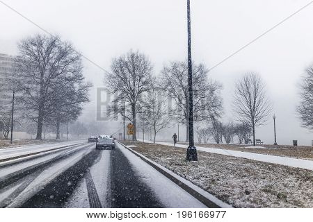 Washington Dc, Usa - January 7, 2017: Winter Snow Storm On Road With Cars, Watergate Building And Ma
