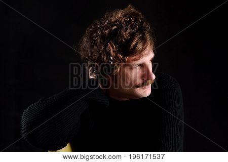 Portrait Of An Attractive Man On Black Background