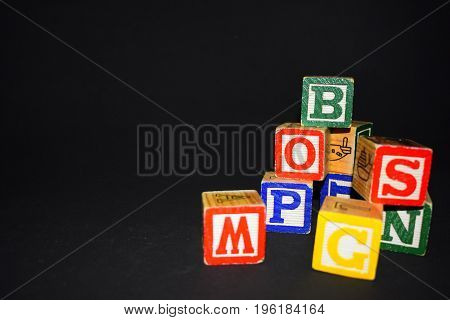 Several wooden cubes waiting for color inspiration
