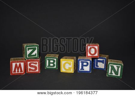Several wooden cubes waiting for color inspiration