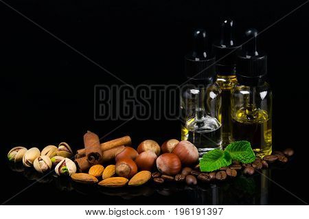 Flavored oils in bubbles surrounded by nuts cinnamon and fresh mint