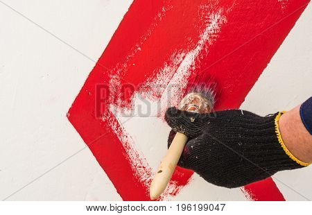 The Hand In The Black Glove Holds The Brush