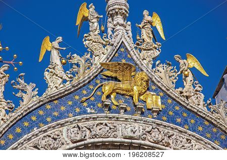 Close-up of sculptures and frontispiece made in marble and gold on the San Marco Basilica. At the city of Venice, the historic and amazing marine city. Located in Veneto region, northern Italy