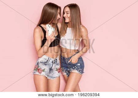 Young Twins Sisters Taking Photos.