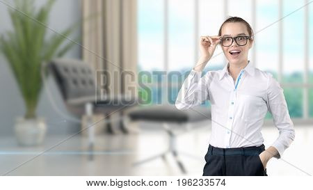 Young Beautiful Business Woman And Creative Designer Standing Over Blured Interior Background