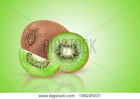 Ripe whole kiwi fruit and half kiwi fruit on green background.