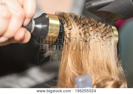 styling hair dryer in a beauty salon
