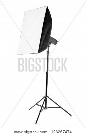 A professional softbox for photo shootings isolated on a white background. A new saturated black softbox on a tall tripod. Photographic business. Equipment for a photo studio.