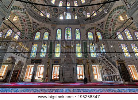 Istanbul, Turkey - April 25, 2017: Fatih Mosque a public Ottoman mosque in the Fatih district of Istanbul Turkey with a huge decorated arches and many colored stained glass windows