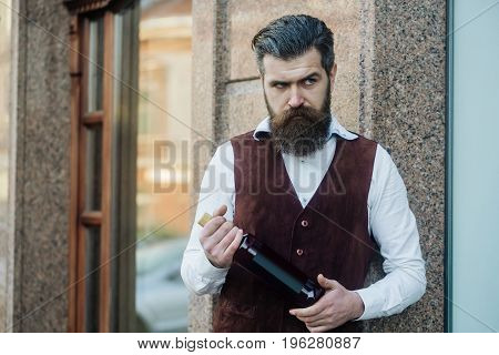 Man Holding Bottle Of Wine