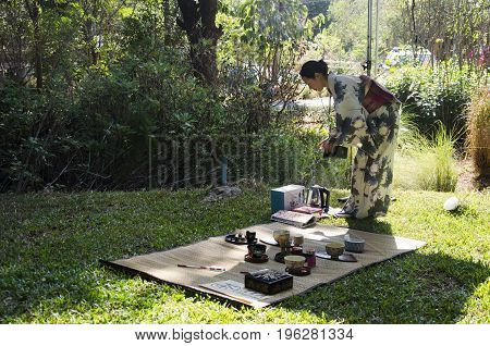 Japanese Women Making Sado Chanoyu Or Japanese Tea Ceremony, Also Called The Way Of Tea At Outdoor