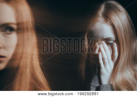 Girl covering her mouth in an emotional breakdown concept