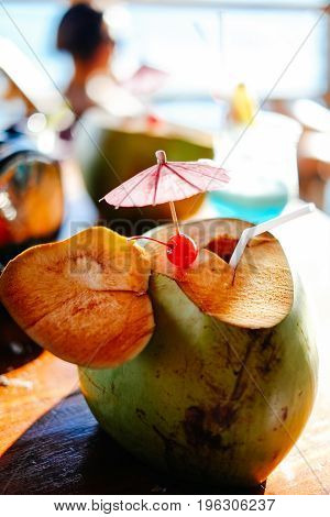 Fresh young coconut at the tropical beach resort in Asia hot summer holiday