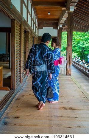 KYOTO, JAPAN - JULY 05, 2017: Unidentified couple taking pictures of the Hojo Hall of Tenryu-ji in the Arashiyama district of Kyoto, Japan.