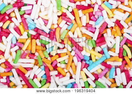 Sugar sprinkle dots decoration for cake and bekery a lot of sprinkles as a background