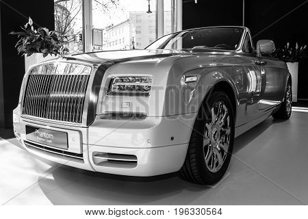 BERLIN - MARCH 08 2015: Showroom. Luxury car Rolls-Royce Phantom Drophead Coupe. Black and white. Rolls-Royce Motor Cars Limited global manufacturer of luxury cars.