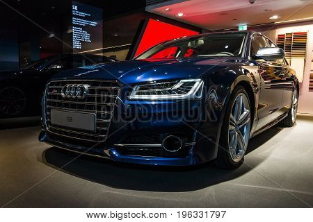 BERLIN - MARCH 08 2015: Showroom. Full-size luxury car Audi S8. Audi AG is a German automobile manufacturer.