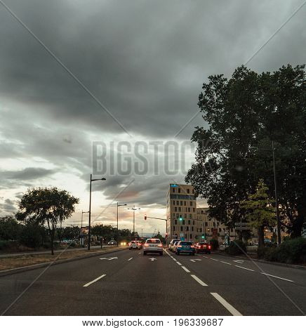STRASBOURG FRANCE - 30 jun 2017: Entrance to Strasbourg from Germany with the RHENA hospital clinic and scary clouds above the city