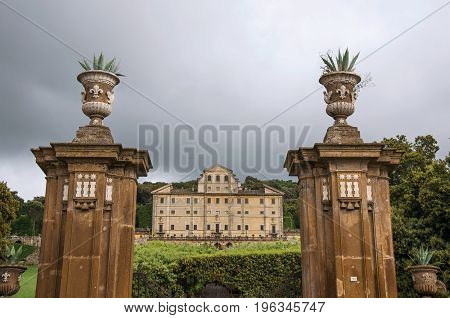 Frascati, Italy - May 23, 2013. Entrance view and facade of building in a villa in Frascati, a pleasant and touristy place known for its wines, near Rome. Located in the Lazio region, central Italy