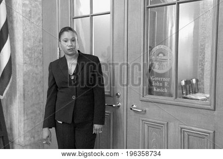 JUNE 26, 2013. COLUMBUS, OHIO. CIRCA: Teacher standing in front of Gov. John R. Kasich office in support of a education allotment.