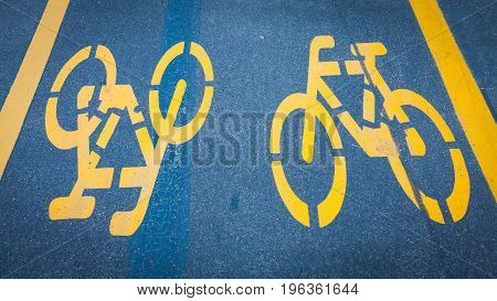 Bicycle Signs Painted On Asphalt