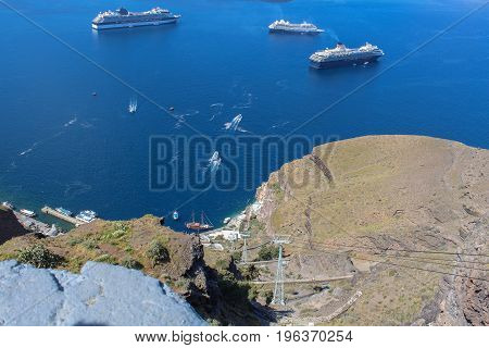 Panoramic view from city of Thira to the caldera and the cableway on Thira Island. Santorini, Greece.