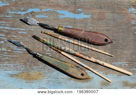 Brushes on a blue old wooden table