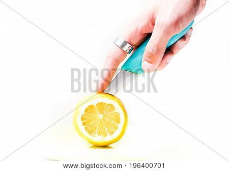 Sour lemon cut with a knife for making juice