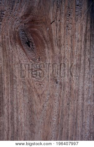 Old wooden surface with gnarl for use as background.