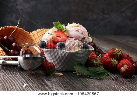 Strawberry Ice Cream In White Bowl With Fresh Strawberries And Blueberries