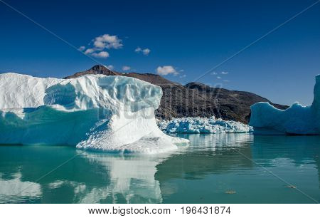 Small icebergs and reflections near the coast Greenland
