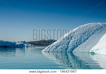 Small icebergs and reflections near the coast Greenland
