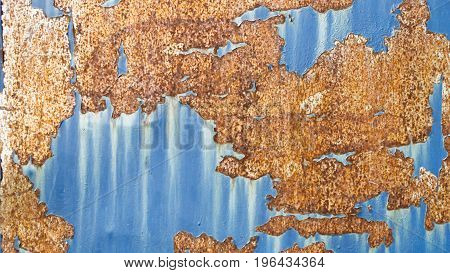 texture of rust pattern on blue metal background.