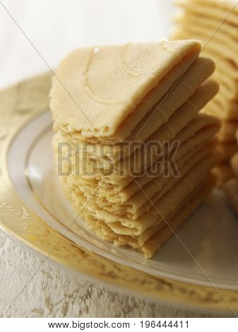 stack of kueh kapit on the plate