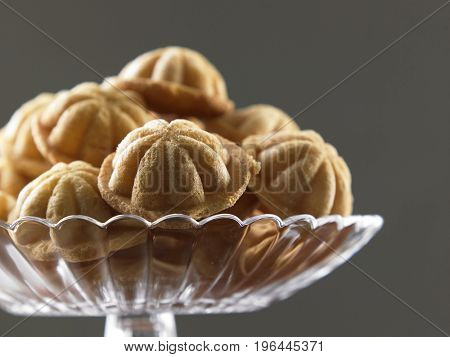 close up of the bahulu  on the glass plate
