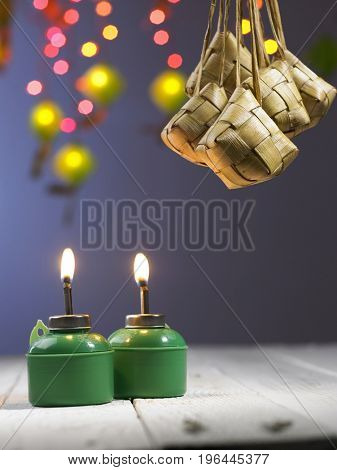 hanging ketupat with the flash light and pelita