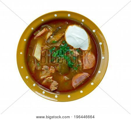 meat seljanka thick spicy and sour Russian soup. ingredient meat pickled cucumbers ham sausages or mushrooms.