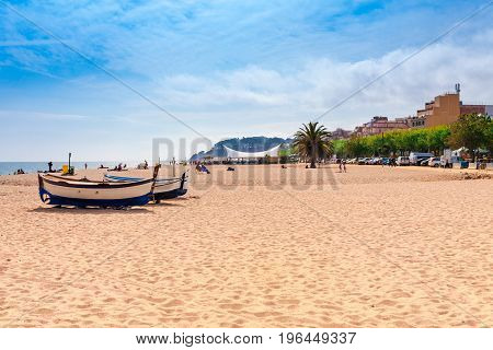 Beach At Seaside In Calella In Catalonia, Spain Near Barcelona. Scenic Old Town With Sand Beach And