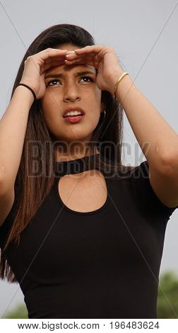 Worrisome Hispanic Person and Wearing a Black Dress