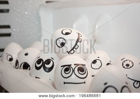 Concept Of Ringleaders In The Company. Face Eggs