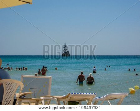 People rest on the beach of the hotel. year 2013