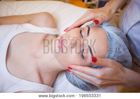 Cosmetology doctor doing massage person woman spa