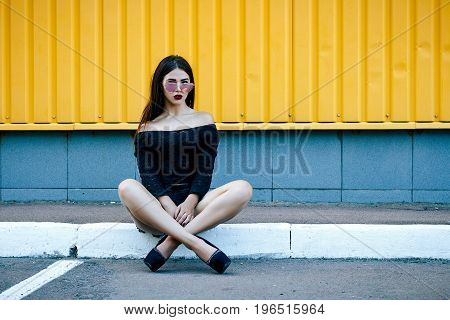 Gorgeous Brunette Girl With A Beautiful Make-up In Fashionable Clothes: A Black Blouse And Shorts Wi