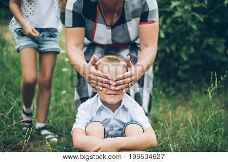 kids playing in the park, guess who, closing each other eye, siter and brother